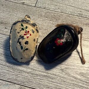 Painted heavy cast iron salt and pepper shakers .